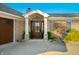 Inviting front entrance with a dark brown door and stone accents at 9454 Raintree S Dr, Columbus, IN 47201