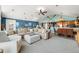 Spacious great room features vaulted ceiling, comfy sectional sofa, and open concept layout at 9454 Raintree S Dr, Columbus, IN 47201