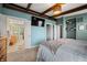 Main bedroom with ensuite bathroom access and a large TV at 9454 Raintree S Dr, Columbus, IN 47201