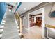 Elegant staircase leading to an open game room at 9454 Raintree S Dr, Columbus, IN 47201