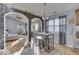 Bright dining area with hardwood floors and view into living room at 1006 Amesbury Ct, Indianapolis, IN 46217