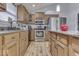 Open kitchen with stainless steel appliances and granite countertops at 1006 Amesbury Ct, Indianapolis, IN 46217