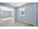 Light and airy hallway with wood flooring and view to living room at 11320 Stoeppelwerth Dr, Indianapolis, IN 46229