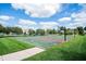 Community basketball court with two hoops at 11890 Pine Meadow Cir, Fishers, IN 46037