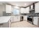 Modern kitchen with stainless steel appliances and white cabinets at 11890 Pine Meadow Cir, Fishers, IN 46037