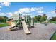 Community playground with slides and play structures at 11890 Pine Meadow Cir, Fishers, IN 46037