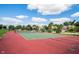 Community tennis courts with red and green surface at 11890 Pine Meadow Cir, Fishers, IN 46037