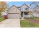 Brick two-story house with attached garage and landscaping at 15960 Arbor Grove Blvd, Noblesville, IN 46060