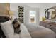 Bedroom with wood accent wall and plenty of light at 19698 Patcham Rd, Westfield, IN 46074