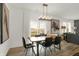 Spacious dining area with a live edge table and black chairs, open to the living room at 19698 Patcham Rd, Westfield, IN 46074