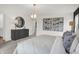 Main bedroom with a dresser, large windows, and modern artwork at 19698 Patcham Rd, Westfield, IN 46074