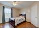 Cozy bedroom with a dark wood bed frame and hardwood floors at 2612 Kirk Ct, Lebanon, IN 46052