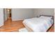 Bedroom with a cozy bed, a fluffy rug, and hardwood floors at 2725 Palo Verde Ct, Indianapolis, IN 46227