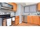 Kitchen with oak cabinets, stainless steel appliances, and light gray walls at 2725 Palo Verde Ct, Indianapolis, IN 46227