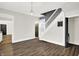 Elegant dining area with hardwood floors, and a modern light fixture at 28 N Denny St, Indianapolis, IN 46201