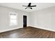 Spacious living room with hardwood floors, fresh paint, and ceiling fan at 28 N Denny St, Indianapolis, IN 46201