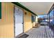 Covered porch with rocking chair, and white door at 33 Miami Dr, Noblesville, IN 46062