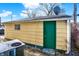 Detached garage with green door and window at 33 Miami Dr, Noblesville, IN 46062