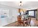 Small kitchen with wooden cabinets and dining table at 33 Miami Dr, Noblesville, IN 46062