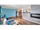 Open concept living room and kitchen with teal walls at 33 Miami Dr, Noblesville, IN 46062