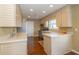 Kitchen with stainless steel appliances and light wood cabinets at 3424 Bay Rd S Dr, Indianapolis, IN 46240