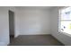 Bright bedroom with window and grey carpet at 3916 Highcrest Rd, Indianapolis, IN 46239