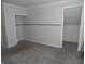 Simple bedroom with neutral walls, carpet flooring, and closet at 443 N Centennial St, Indianapolis, IN 46222
