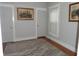Bright bedroom with hardwood floors, neutral walls, and a large window at 443 N Centennial St, Indianapolis, IN 46222
