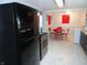 Kitchen with black appliances and marble-look tile floor at 443 N Centennial St, Indianapolis, IN 46222
