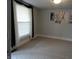 Bright living room featuring a large window and wall art at 443 N Centennial St, Indianapolis, IN 46222