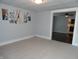 Open living room with view into kitchen and dark hardwood floors at 443 N Centennial St, Indianapolis, IN 46222