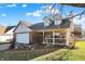 Attractive brick home with dormer windows and a welcoming porch at 4607 Common Vista Cir, Indianapolis, IN 46220