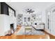 Bright living room with hardwood floors, ceiling fan, and built-in shelving at 514 W 43Rd St, Indianapolis, IN 46208