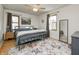 Serene bedroom with a metal bed frame and area rug at 6017 N Oakland Ave, Indianapolis, IN 46220