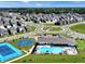 Aerial view of a community with homes, a pool, and recreational areas at 6169 Granby Dr, Whitestown, IN 46075