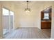 Dining area with sliding glass doors leading to the backyard at 7144 Kimble Dr, Indianapolis, IN 46217