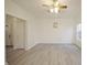 Spacious living room with light gray vinyl flooring and ceiling fan at 7144 Kimble Dr, Indianapolis, IN 46217