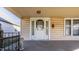 Classic front porch with a white door and stone lion statue at 839 N Oxford St, Indianapolis, IN 46201