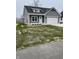 Gray sided house with white garage doors and landscaping at 850 E Nutter St, Martinsville, IN 46151