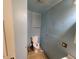 Small bathroom with light blue walls and a toilet at 937 N Olney St, Indianapolis, IN 46201