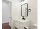 Stylish bathroom, white vanity, and black matte fixtures at 1018 Calvary St, Indianapolis, IN 46203