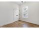 Bedroom with hardwood floors, window, and closet at 1018 Calvary St, Indianapolis, IN 46203