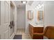 Basement bathroom with shower, vanity, and wicker chair at 10802 Midnight Dr, Indianapolis, IN 46239