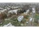 Aerial view of neighborhood with houses and a frozen pond at 10802 Midnight Dr, Indianapolis, IN 46239