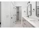 View of the double vanity bathroom leading to a walk-in closet at 1230 N Alabama St, Indianapolis, IN 46202