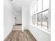 Welcoming entryway with stairs, large window, and wood-look flooring at 1230 N Alabama St, Indianapolis, IN 46202
