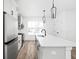 Contemporary kitchen with marble countertops, stainless steel appliances, and ample counter space at 1230 N Alabama St, Indianapolis, IN 46202