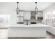 Modern kitchen featuring white cabinets, marble countertops, and stainless steel appliances at 1230 N Alabama St, Indianapolis, IN 46202