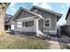 Recently renovated gray craftsman home with a white porch at 1315 Winfield Ave, Indianapolis, IN 46222