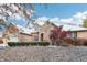 Brick home with a three-car garage and landscaping; light dusting of snow at 142 E Banta Rd, Indianapolis, IN 46227